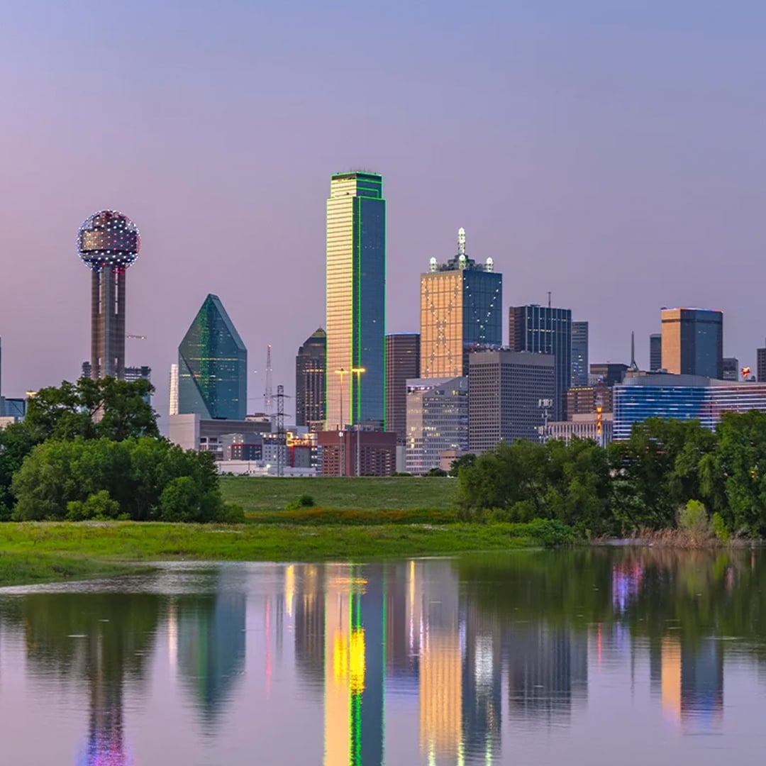 Dallas skyline reflected in the water at dusk