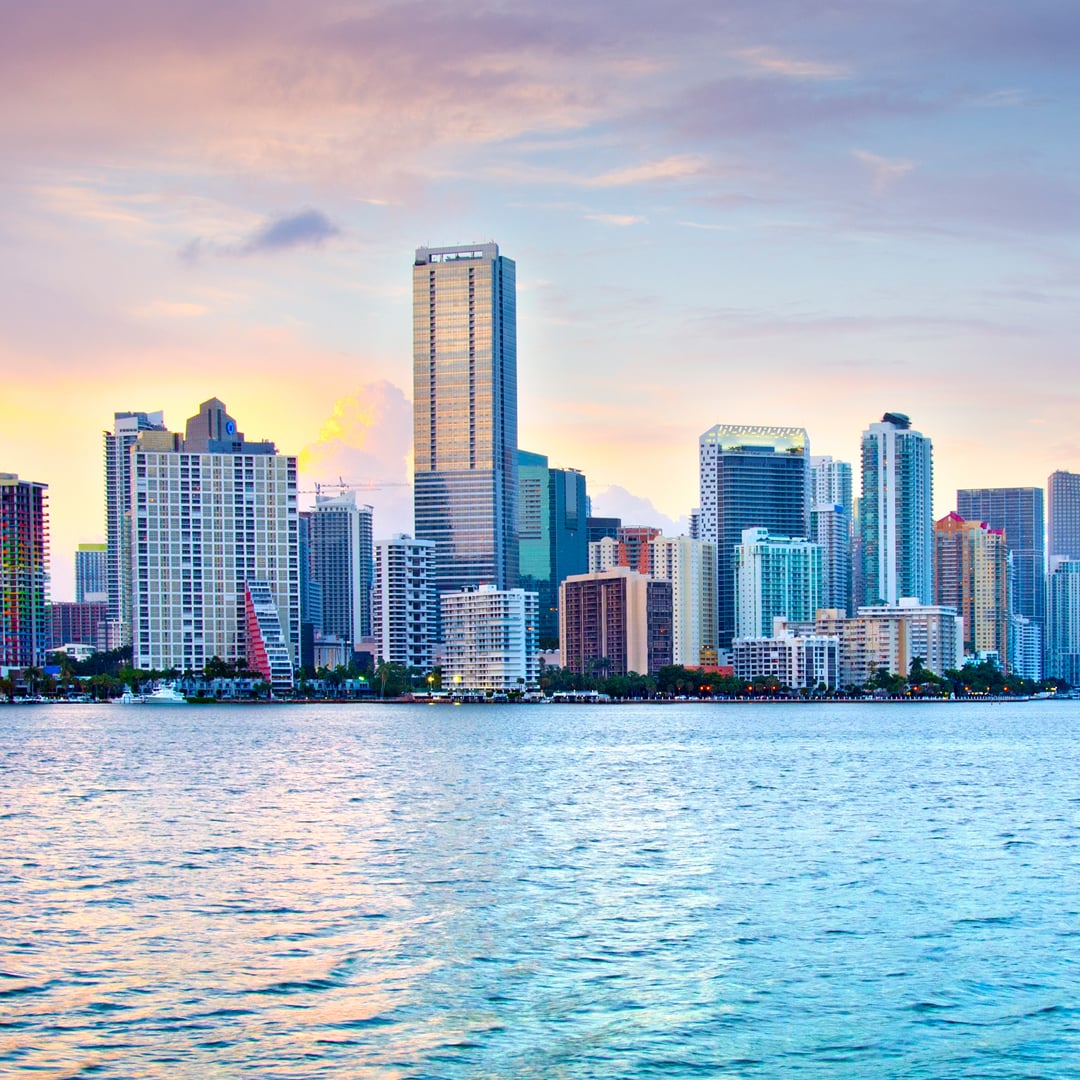 Miami skyline across the water at sunset
